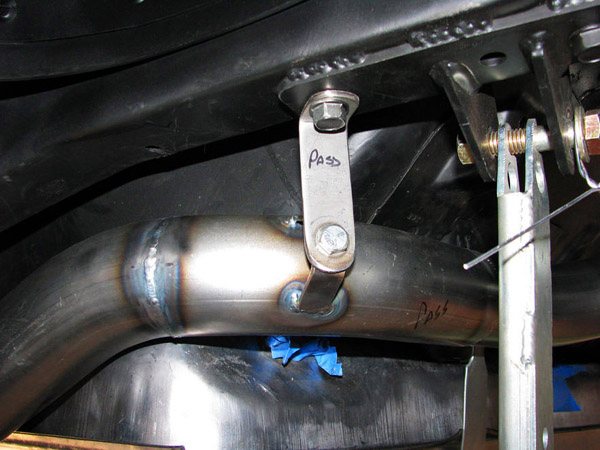 Universal mufflers are created for use on a number of different vehicles. This photo shows a universal muffler system that needed cutting and welding to rectify pipe diameter and length issues. A makeshift hanger was created because none existed to match vehicle factory support locations.